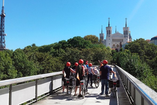 4h Complete Lyon Experience: E-Bike, Food Tasting & Old Town Walk - Place Bellecour and the Rhône Bike Lanes That Make It Easy