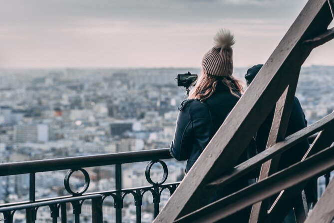 Eiffel Tower Elevator Tour with Optional Summit & Cruise Access - Stop 1 near the base: learning the Dame de Fer story before the views