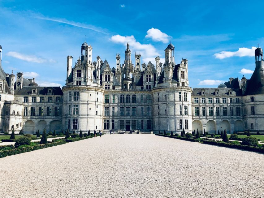 From Tours: Chenonceau and Chambord Castles Guided Tour - Château de Chambord: moat, Renaissance spectacle, and the double helix you came for