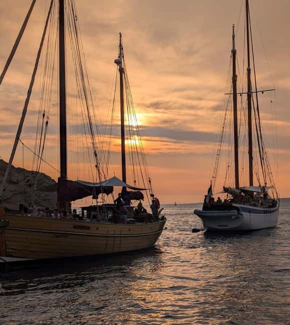 Marseille: Evening sailboat trip to the Calanques du Frioul with buffet and organic wine - Sunset from the water, then back to the Old Port under city lights