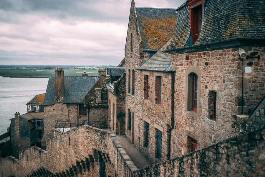 Mont Saint-Michel: Guided tour of the village and optional abbey entrance - The medieval village walk: cobbled lanes, legends, and tide context