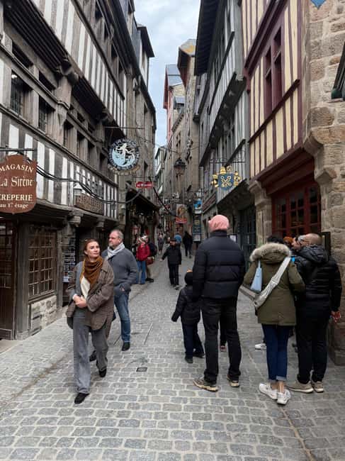 Mont Saint-Michel: Guided tour of the village and optional abbey entrance - Navettes le Passeur, meeting point, and getting to the village without stress