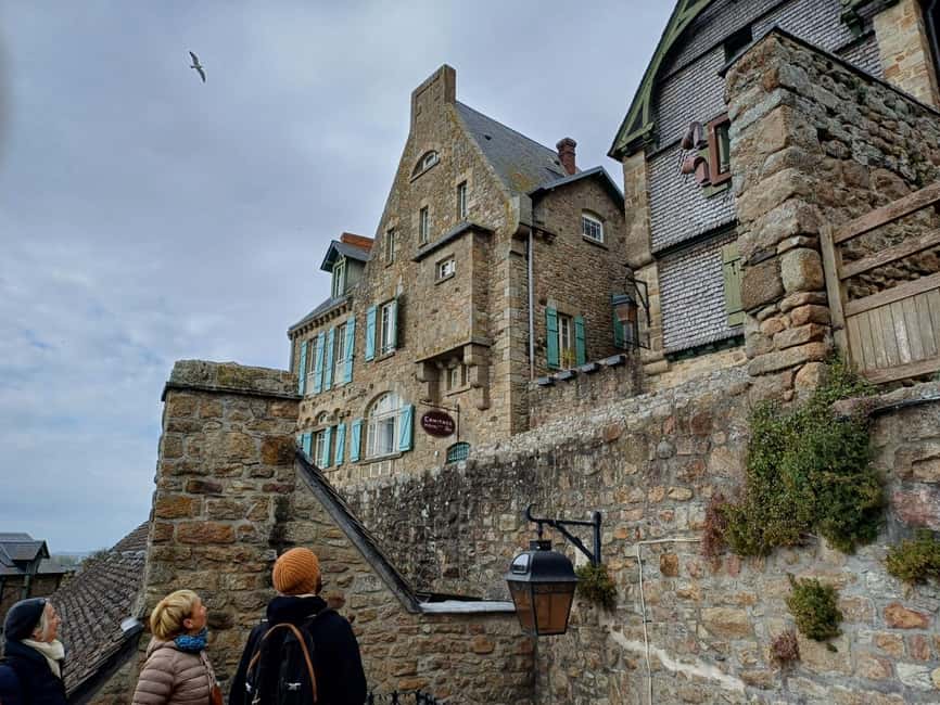 Mont Saint Michel: Village History and Legends Walking Tour - Getting There: Meeting Point, Shuttle, and the Bridge Choice