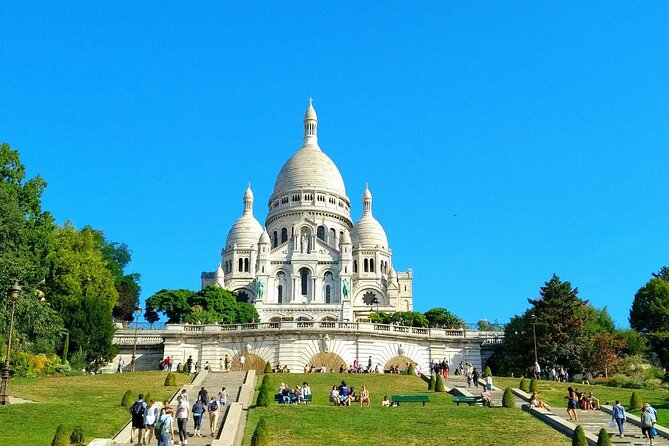 Montmartre Hill French Gourmet Food and Wine Tasting Walking Tour - Meeting at Place Blanche, then straight into Montmartre mode