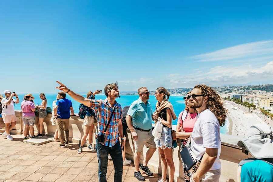 Nice: Old Town & Castle Hill Informative Guided Walking Tour - Place Massena: Red Facades, Piedmontese Style, and the Fountain of the Sun