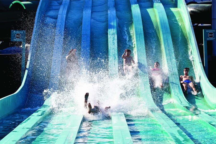 Paris: Aquaboulevard Water Park Entrance Ticket - Jacuzzis, sandy beach, and those Mauritius straw huts