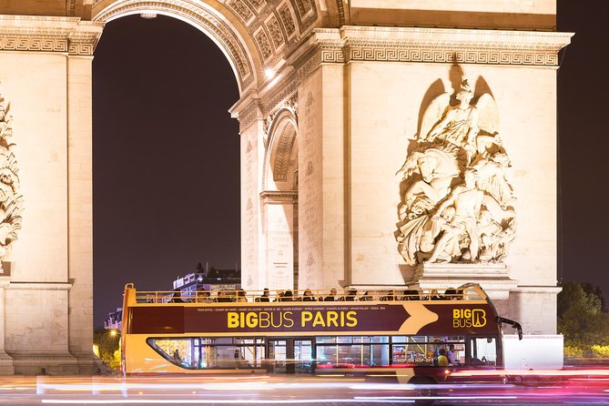 Paris Big Bus Open Top Panoramic Night Tour - Louvre and River Views: Carrousel du Louvre, Seine, and Notre-Dame From a Bus