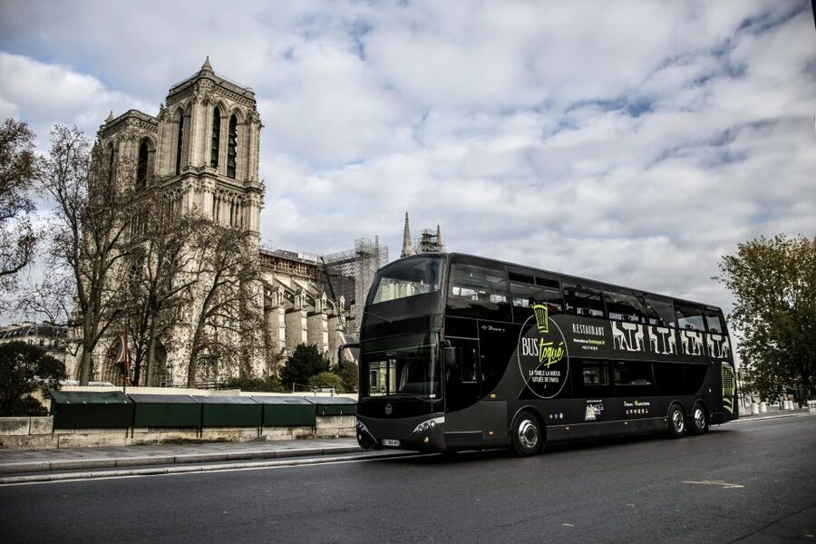 Paris: Champs Elysées Bus Toqué w/Lunch & Glass of Champagne - Entering the glass-roof Bus Toqué experience