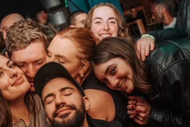 Paris: City Center Guided Pub Crawl with Shots & Club Entry - Stop 1: free shot energy and happy-hour pricing