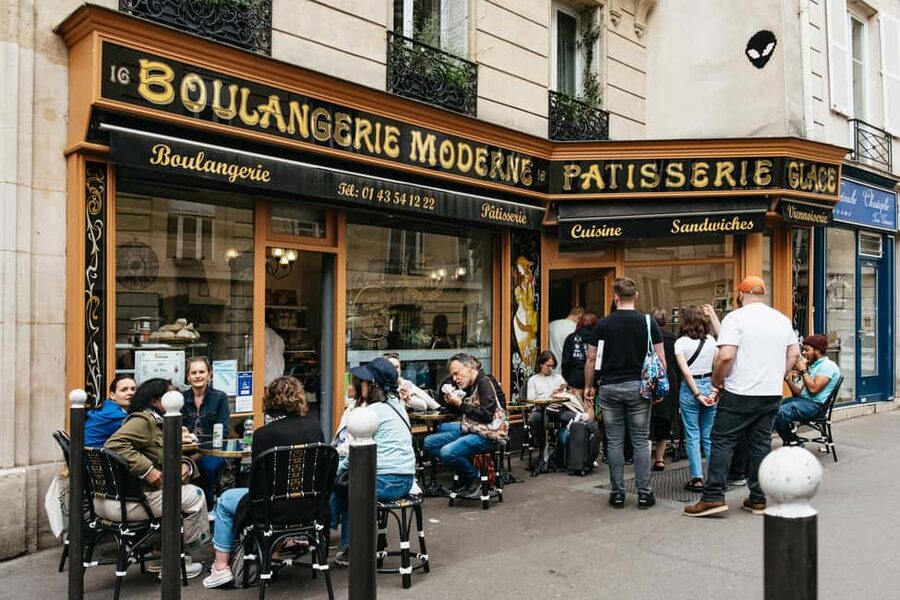 Paris: Emily TV Show Locations Guided Walking Tour - Place de lEstrapade Start Point, Orange Sign Energy, and the Pace