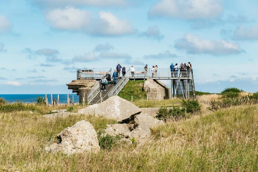 Paris: Normandy D-Day Sites Guided Day Trip with Lunch - Utah Beach Museum: artifacts, bunker walls, and a shore view