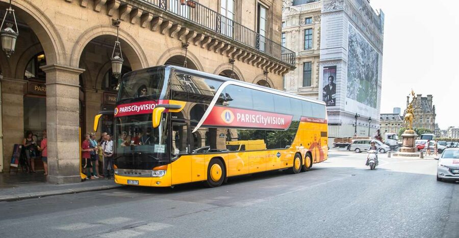Paris: Openair Double Decker Bus Audio-Guided City Tour - Comfort on an enclosed double-decker, and how to get the best views