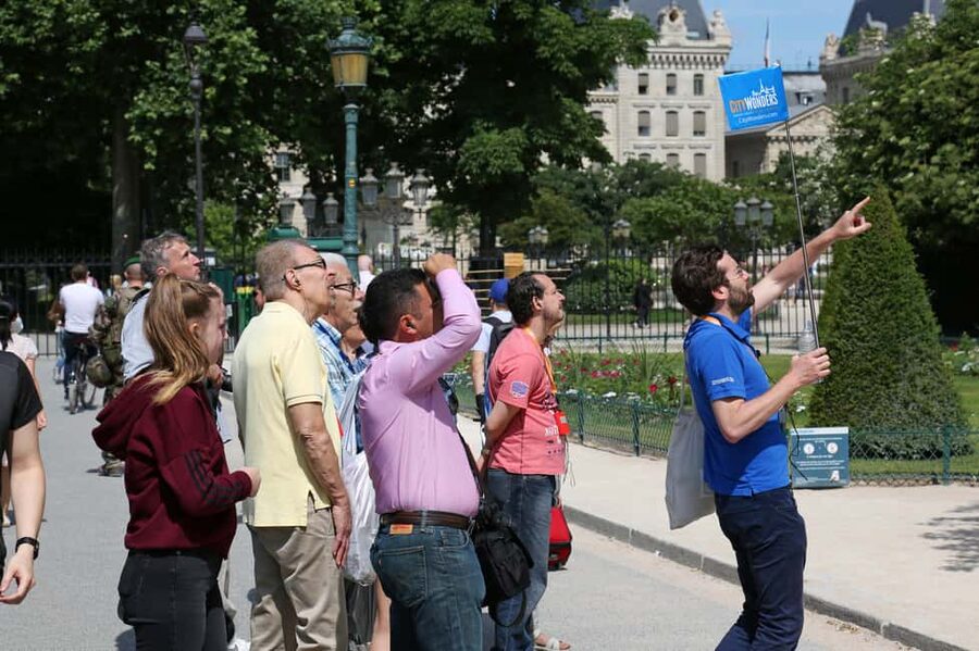 Paris: Walking Tour with Notre Dame or Ste-Chapelle Access - Conciergerie and Place Dauphine, where the tour turns into a story